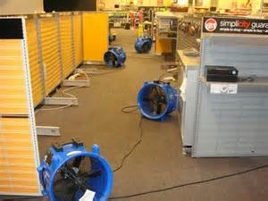 water damage fans in office after storm damage